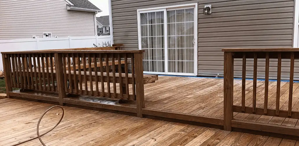 Deck sealing service protecting a backyard wood deck and railings in Spokane, WA