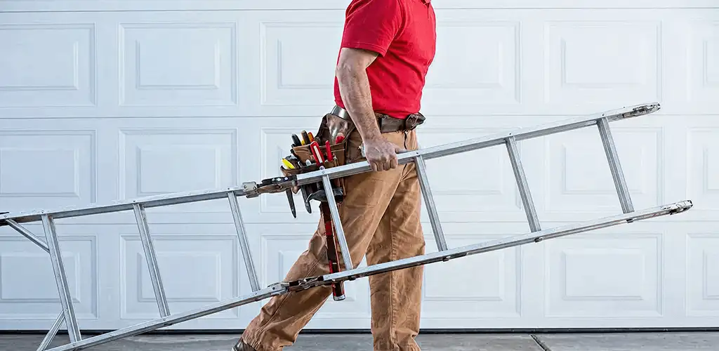 Garage door repair technician arriving with tools and ladder in Spokane, WA