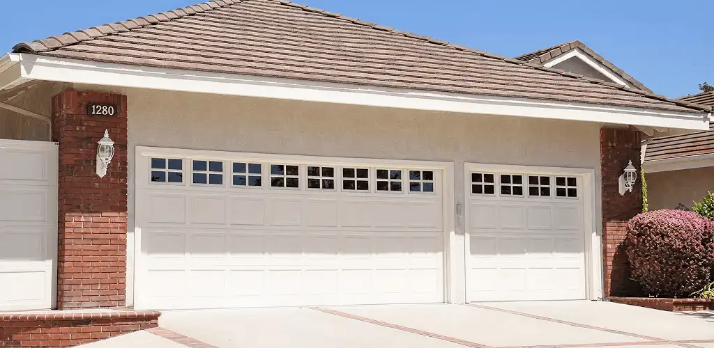 Residential garage door repair service for a double garage door in Spokane, WA