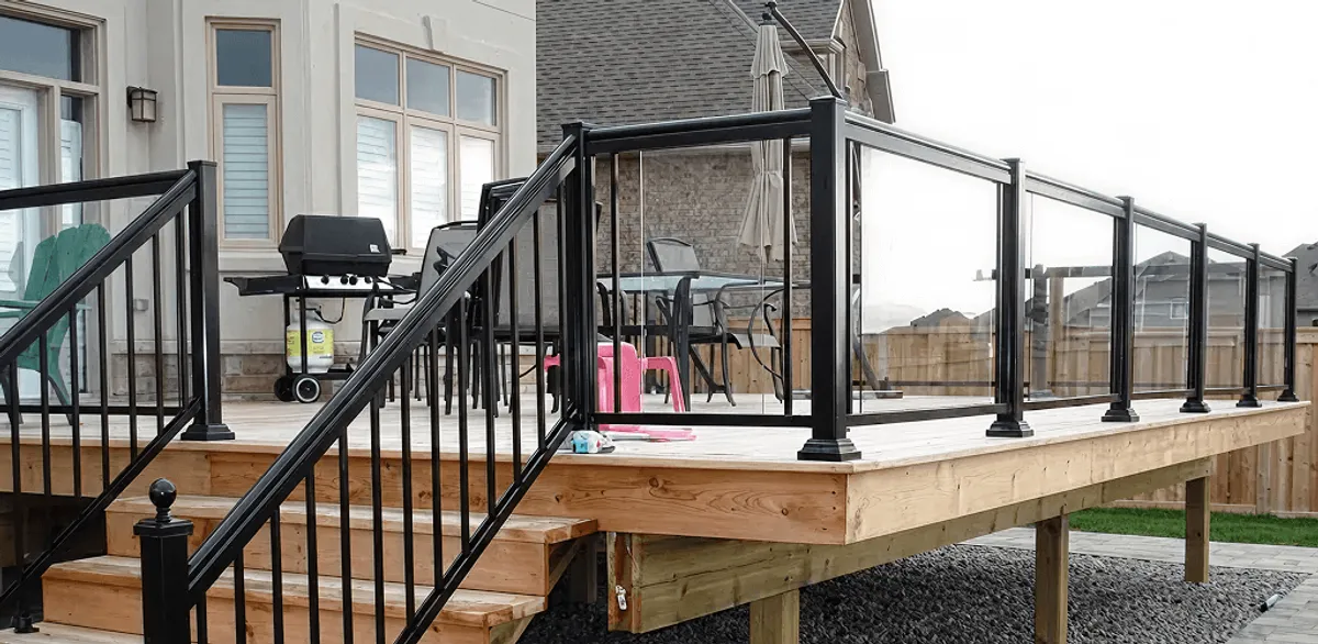 Handrail installation on a deck staircase for safety and code compliance in Spokane, WA
