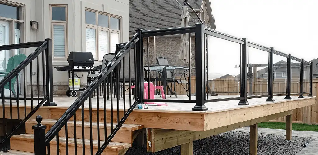 Handrail installation on a deck staircase for safety and code compliance in Spokane, WA