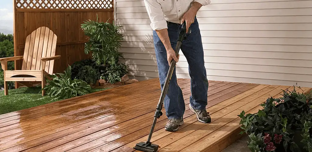 Deck staining service applying stain to a backyard wood deck in Spokane, WA